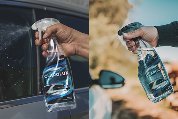 Sisbrill Clarolux Limpiacristales con Repelente de Lluvia de 1 Litro siendo aplicado sobre la ventanilla de un coche para limpiar los vidrios